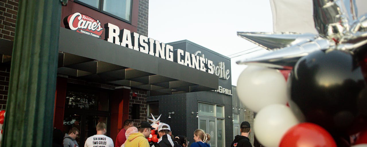 Customers waiting outside Raising Cane's