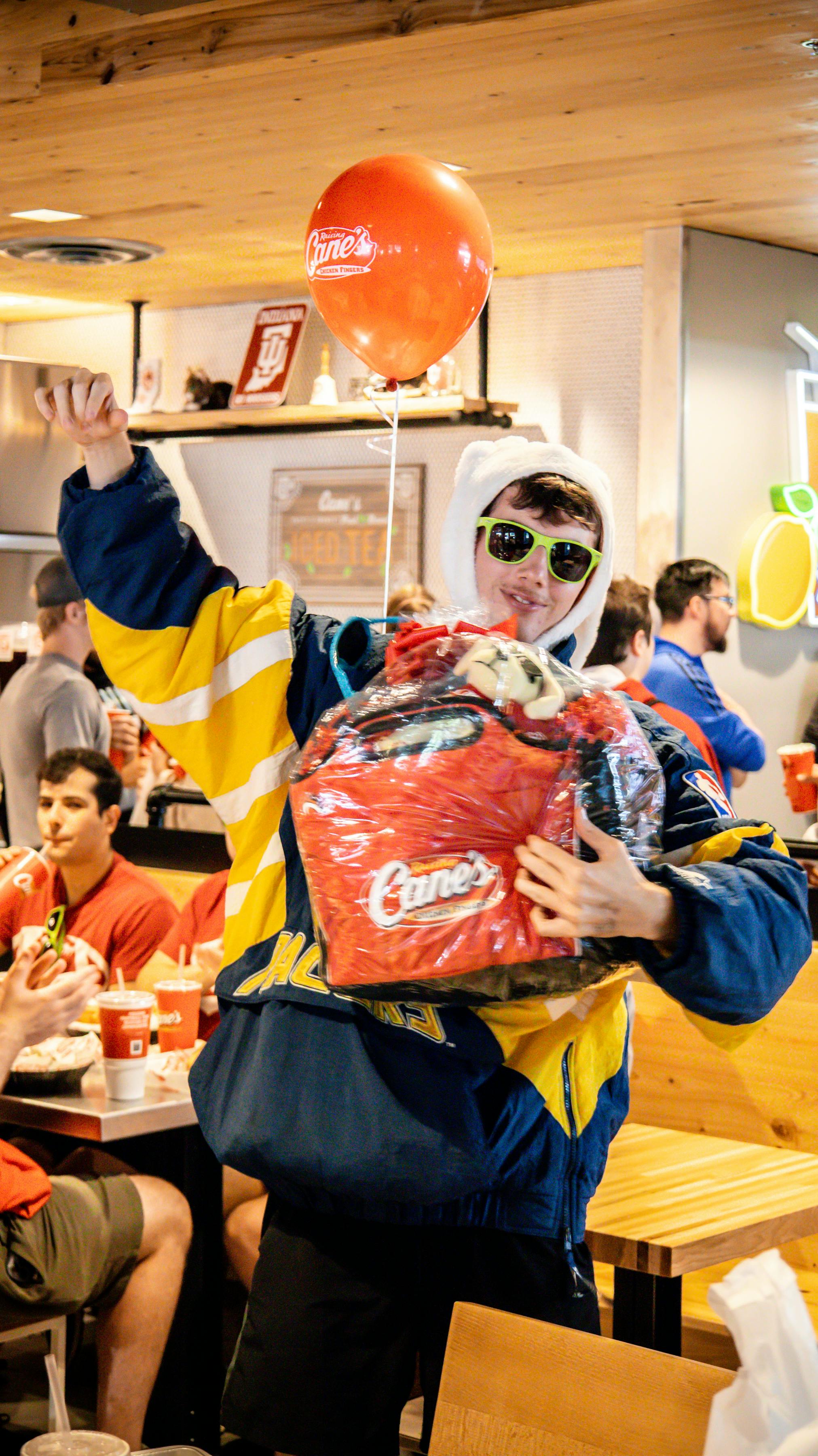 Caniac celebrating inside Raising Cane's