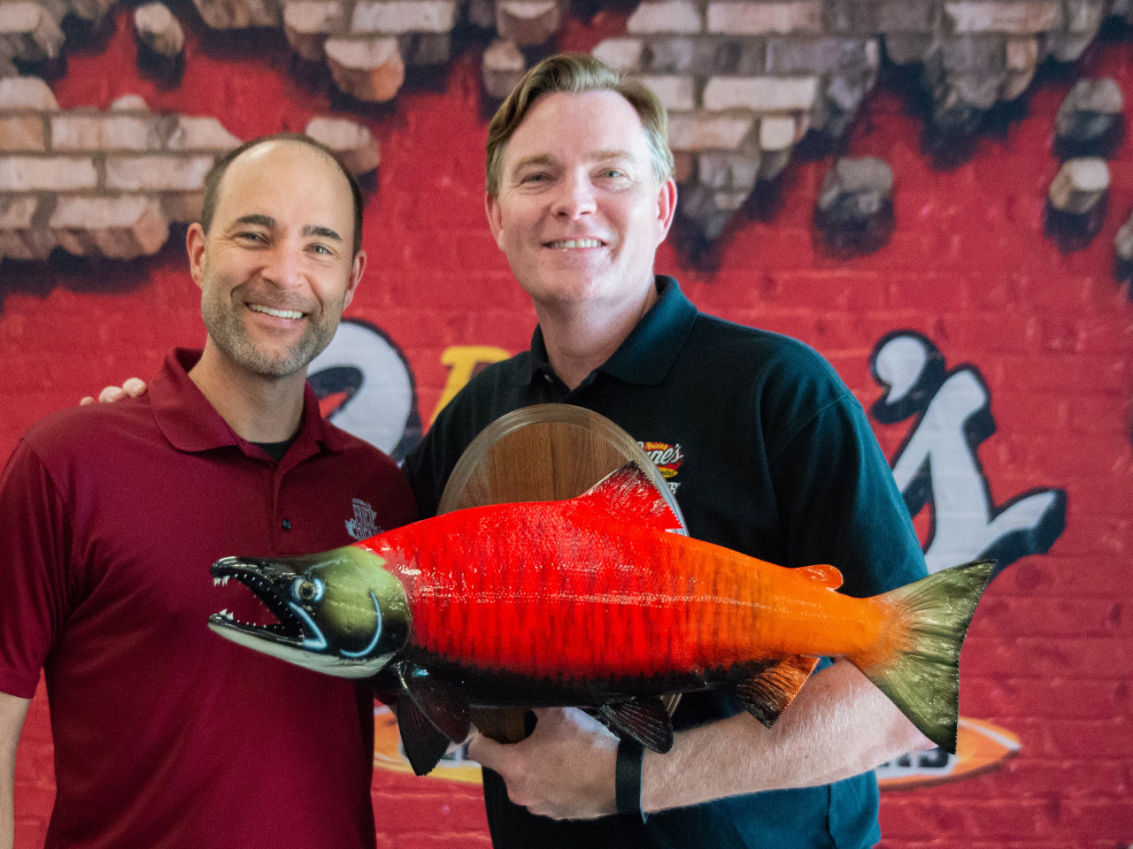 Two Crewmembers holding fish