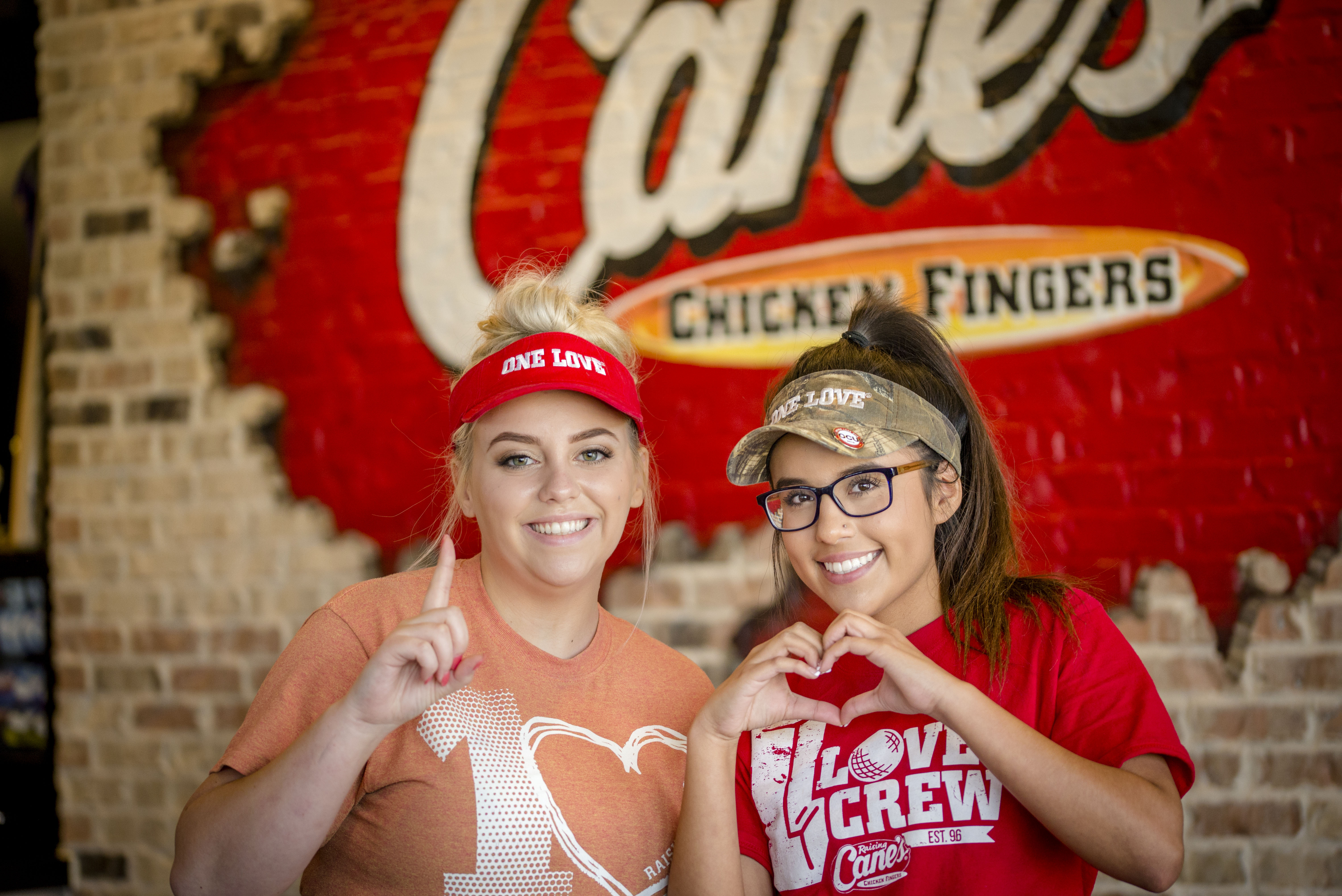 Two Crewmembers showing One Love