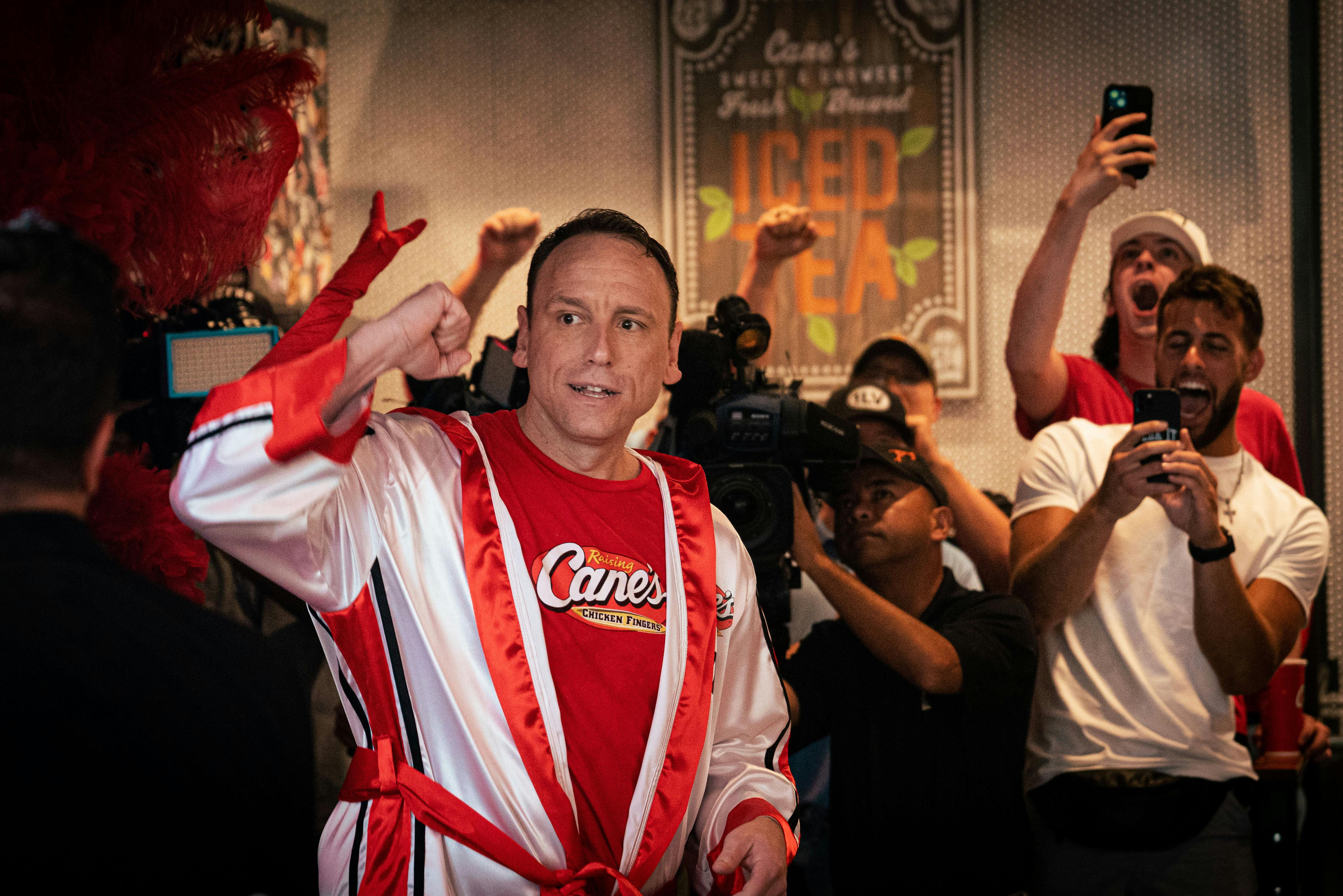 Joey Chestnut being cheered on by fans