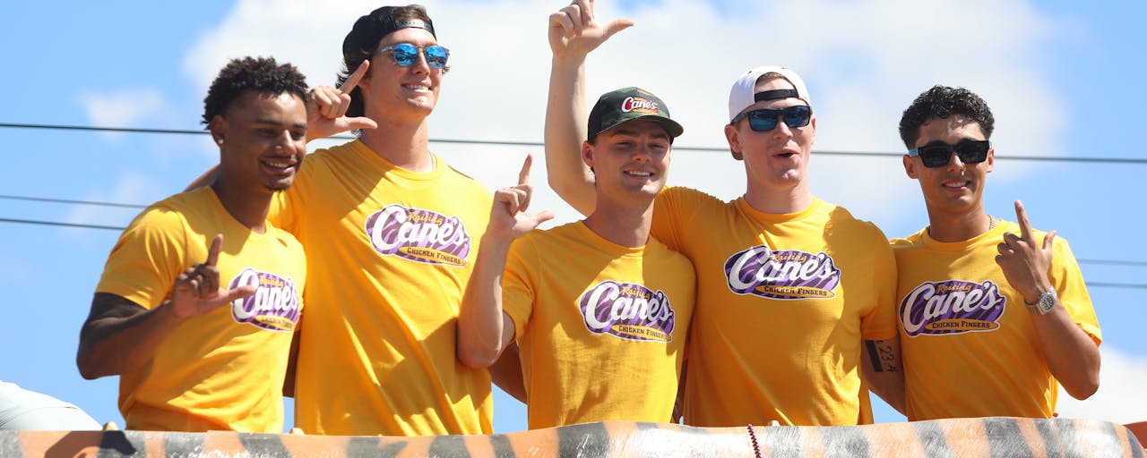 College baseball players Jared Jones, Kade Anderson, Anthony Eyanson, Derek Curiel and Chase Shores celebrating their big win at Raising Cane's