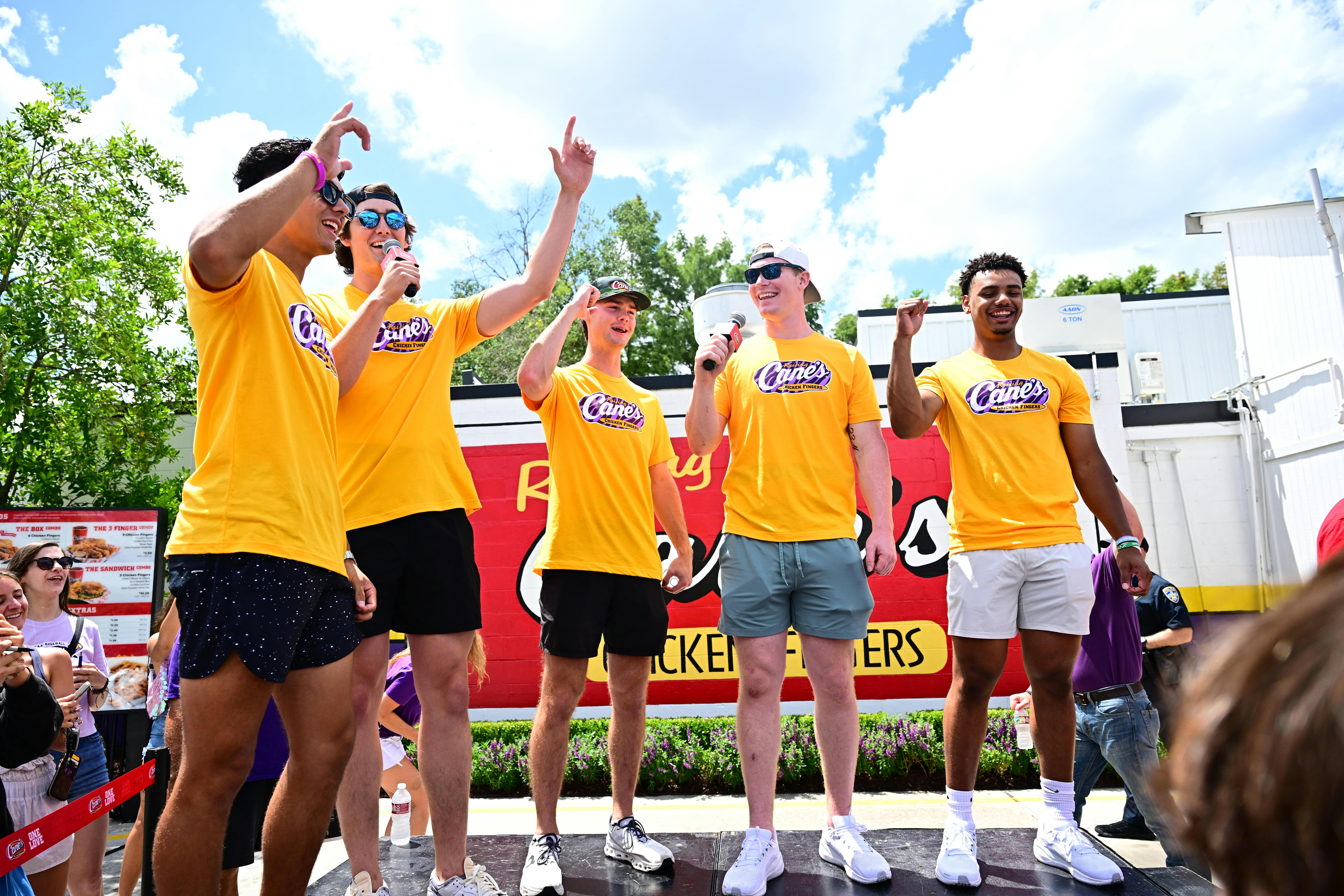 College baseball players Jared Jones, Kade Anderson, Anthony Eyanson, Derek Curiel and Chase Shores celebrating their big win at Raising Cane's