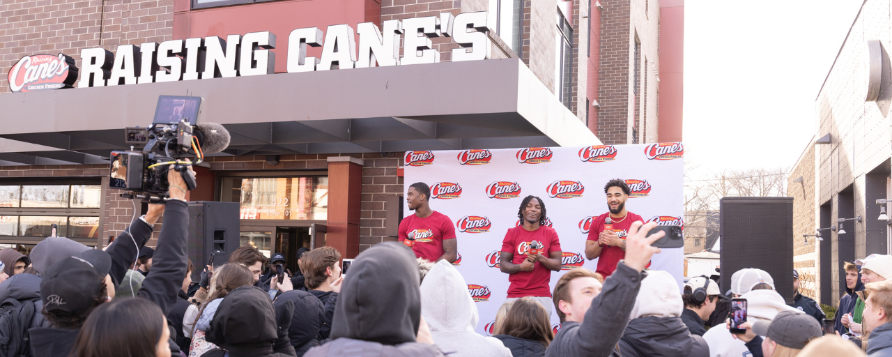 Jamari, D'Angelo, and Elijah with fans at Raising Cane's