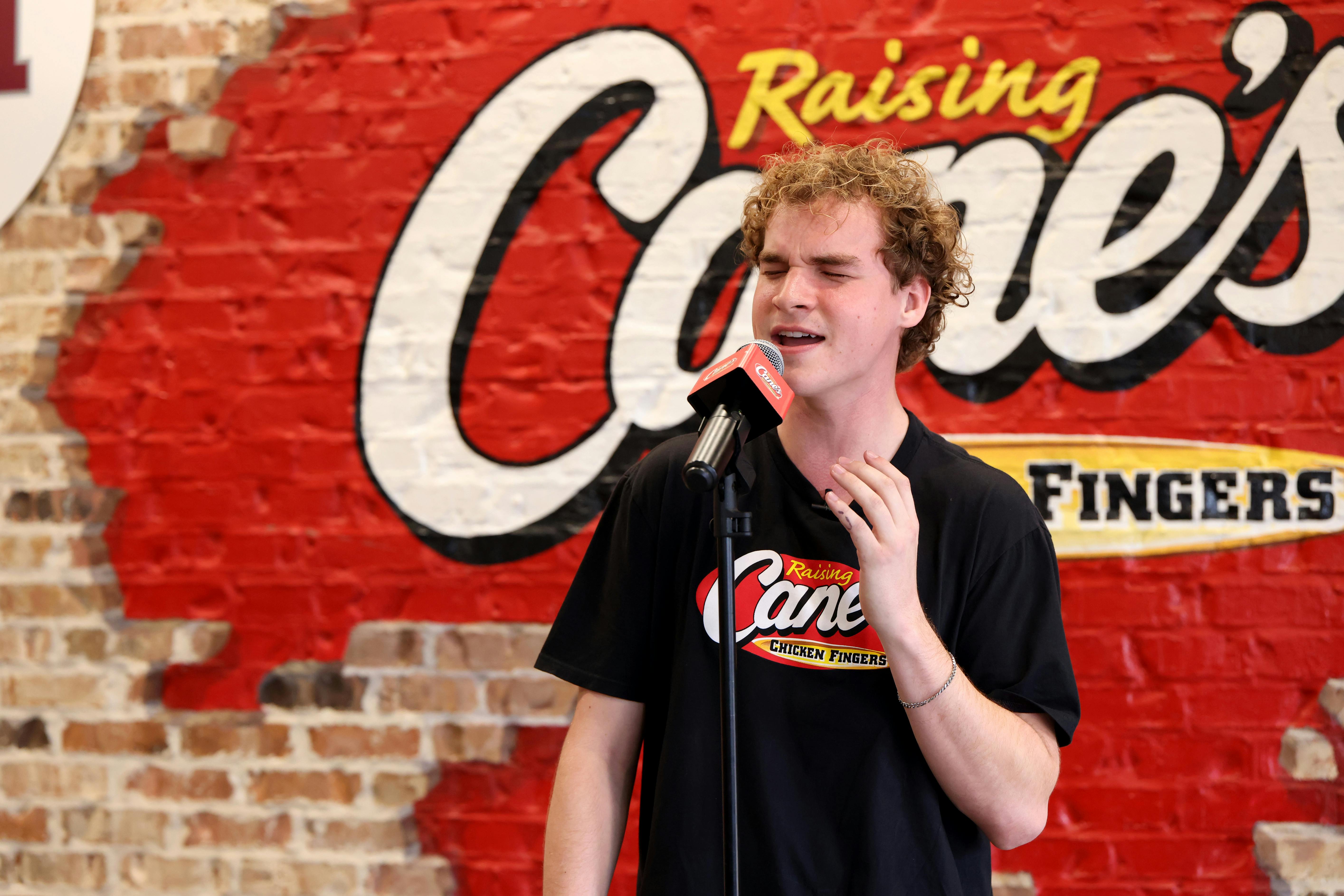Aiden Ross singing at Raising Cane's