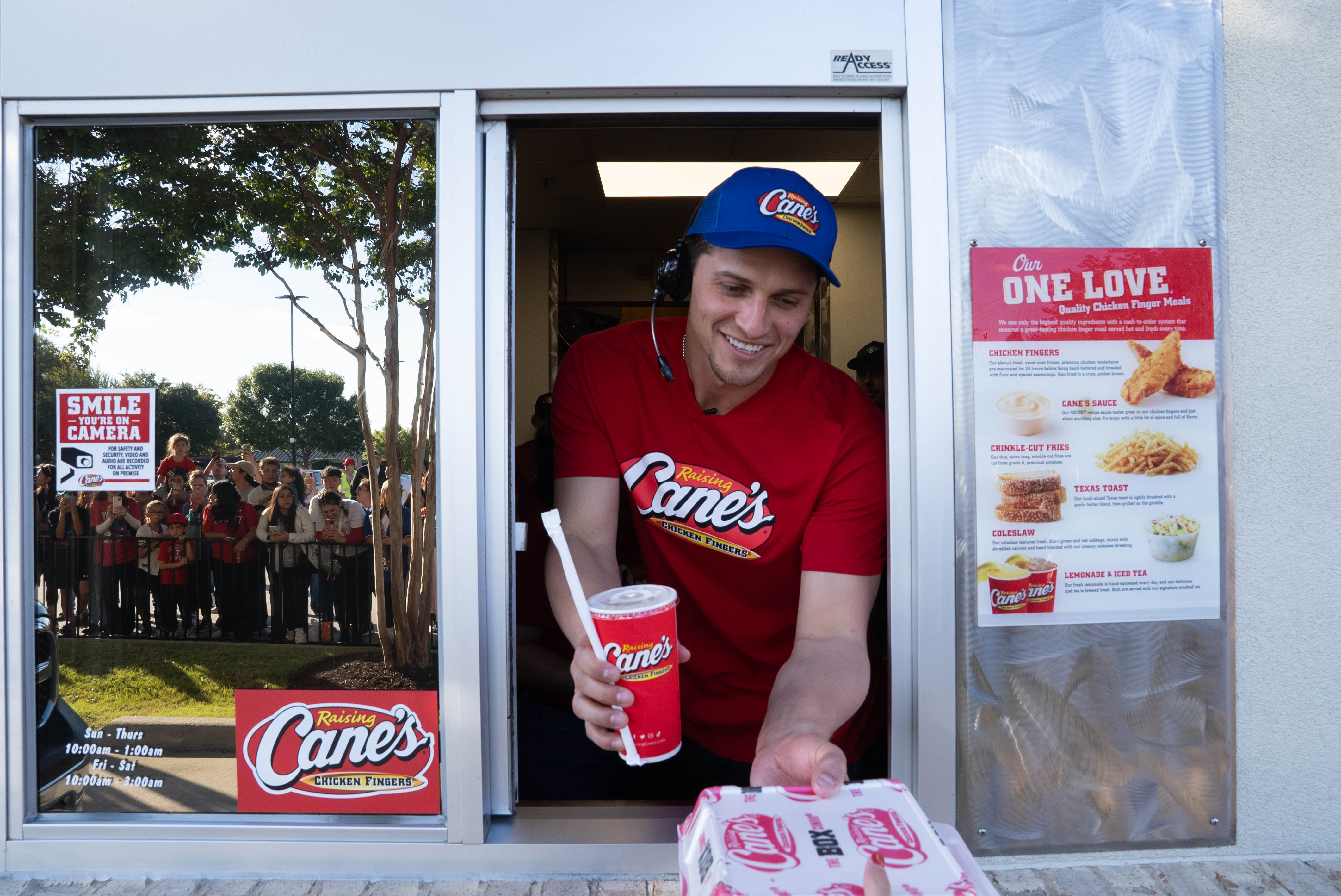Corey Seager working the drive thru at Raising Cane's