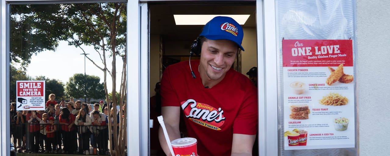 Corey Seager working the drive thru at Raising Cane's