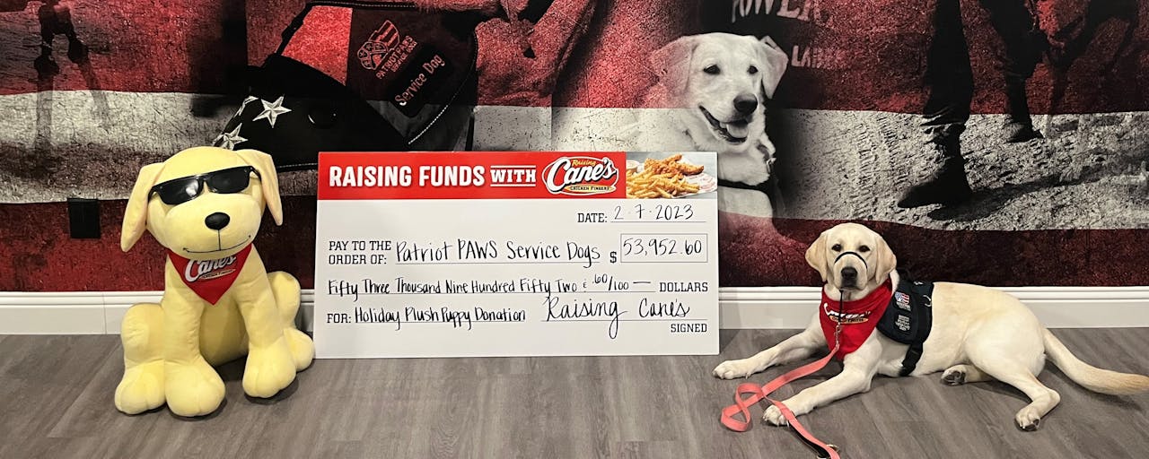 Patriot Paws and Raising Cane's Check Presentation