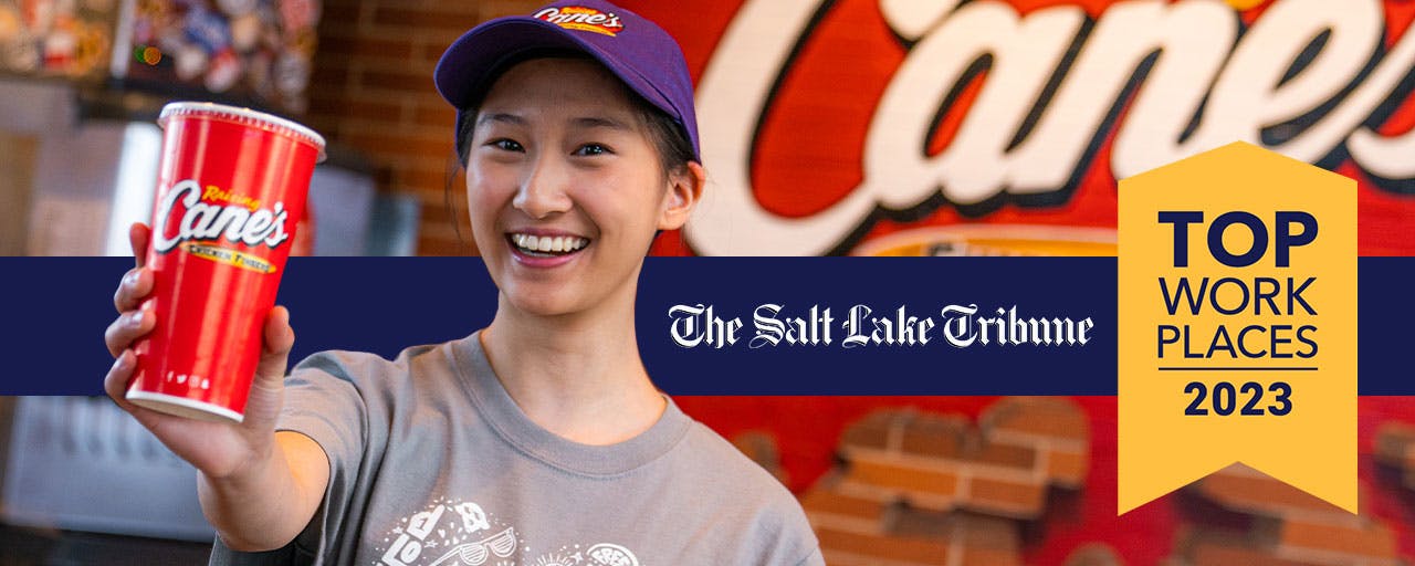 Raising Cane's Crew Member celebrating Top Workplace Award for Salt Lake Tribune