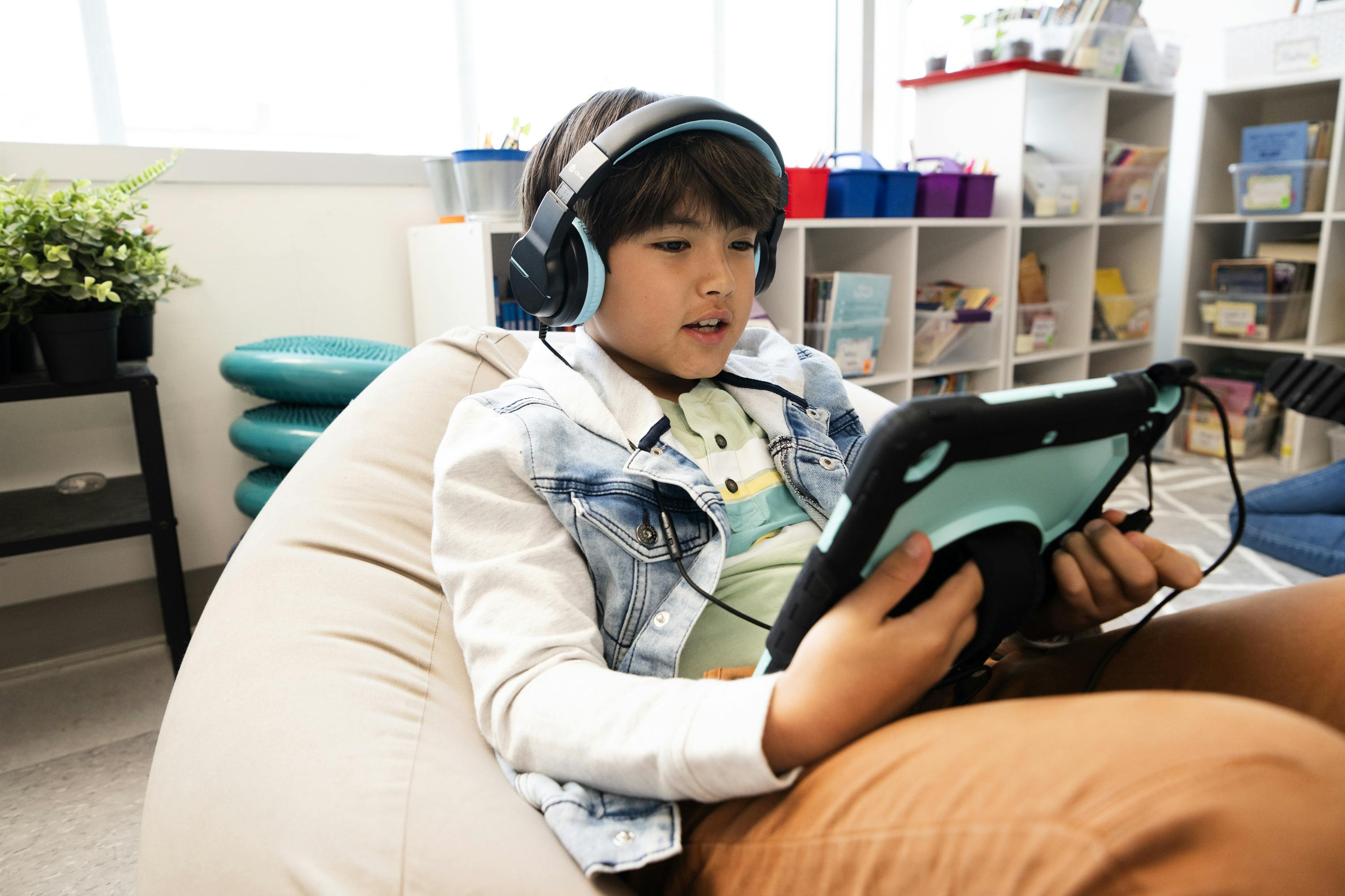 A student reads independently in a classroom