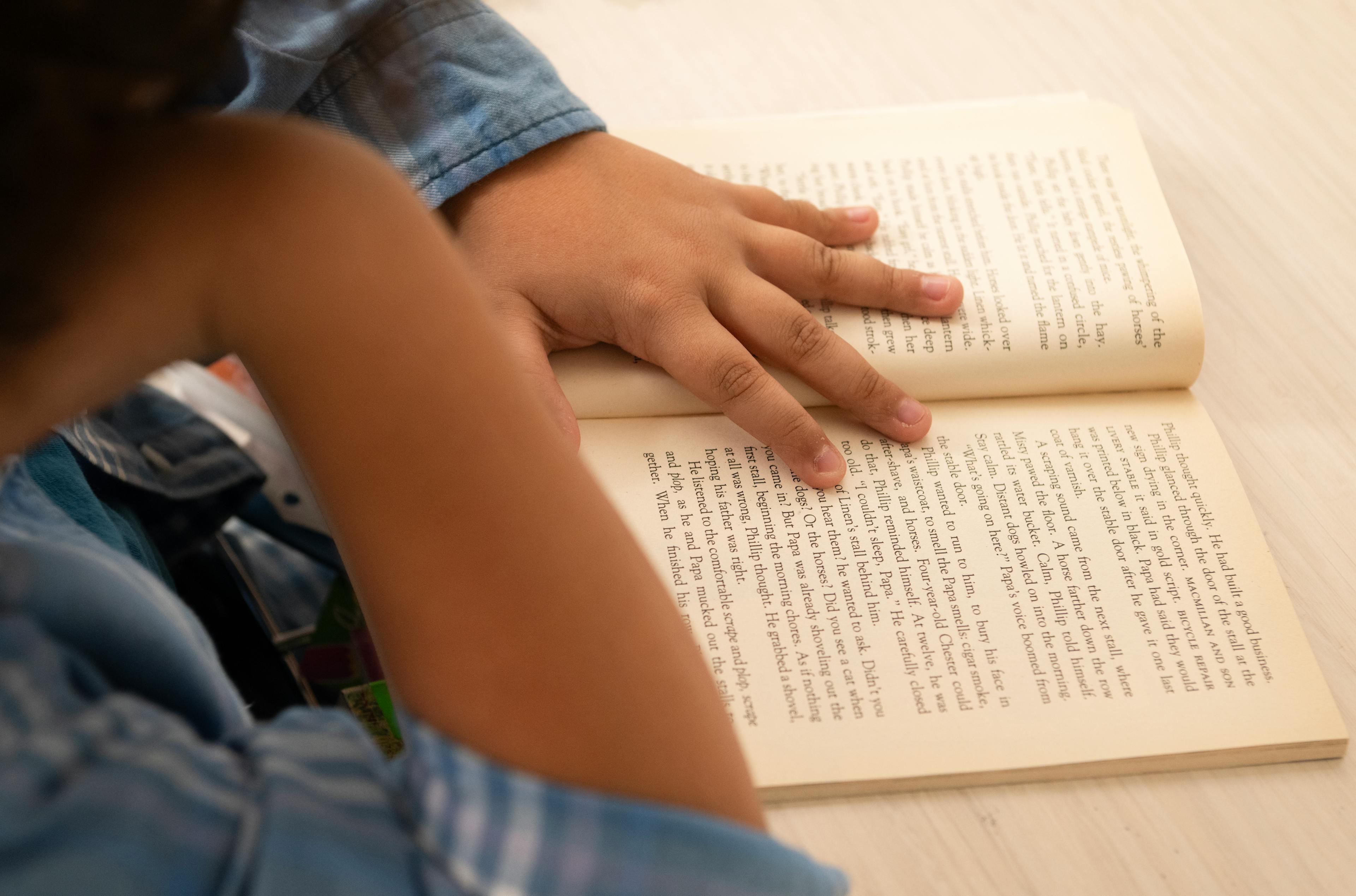 A child reads on a print book