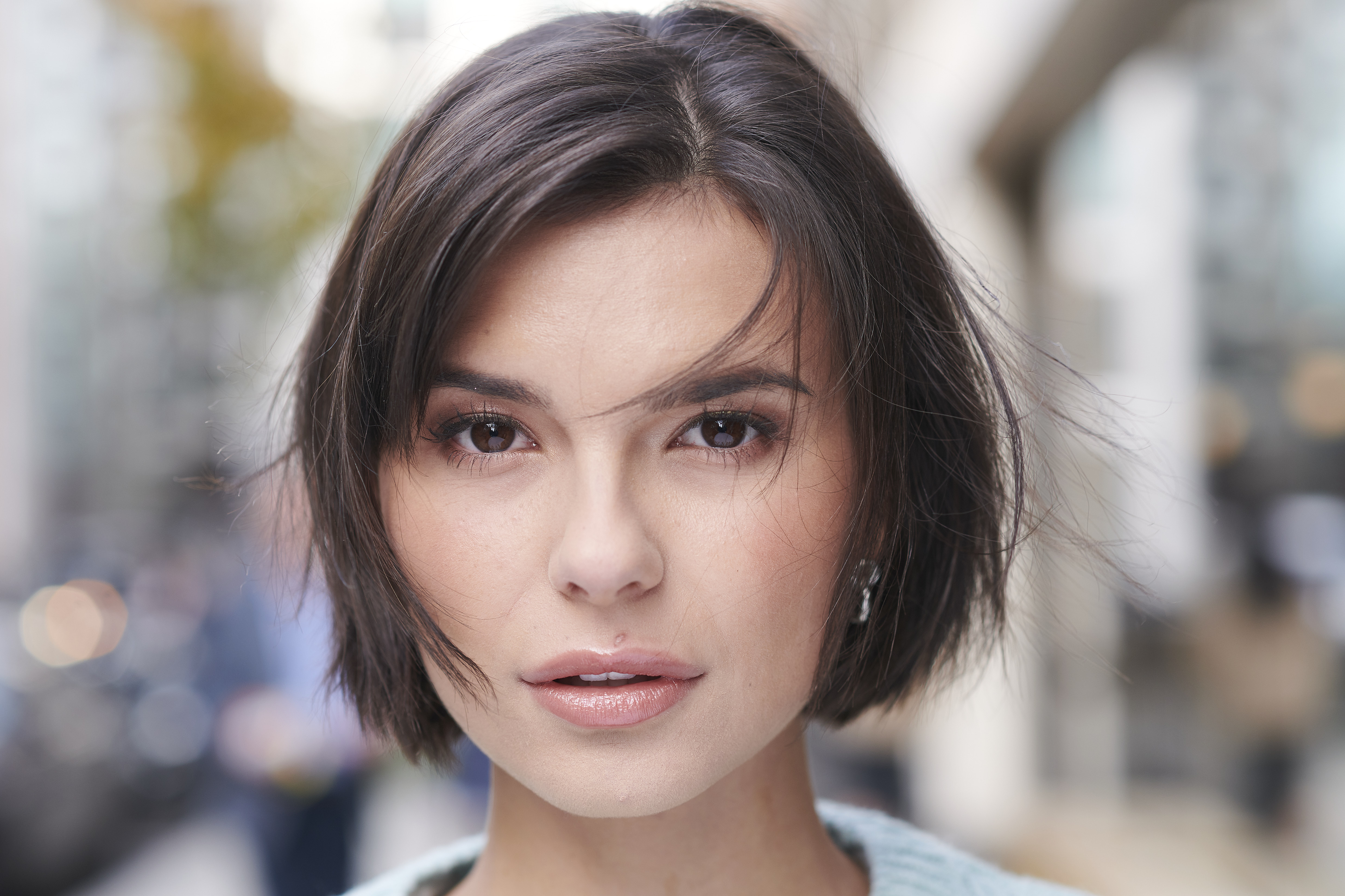 Close up of curly dark haired girl with brown eyes
