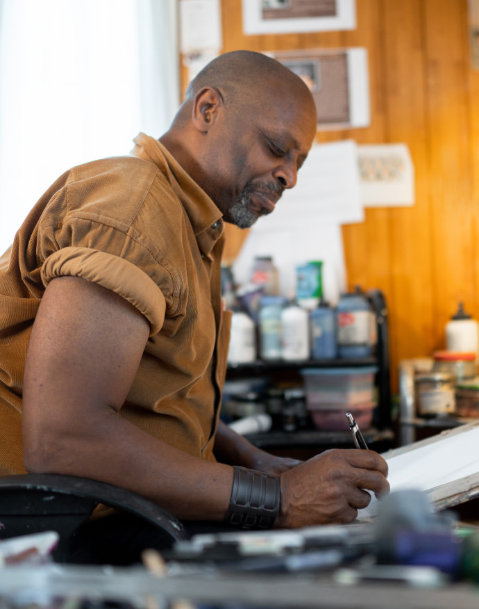 Randy DuBurke working in his studio