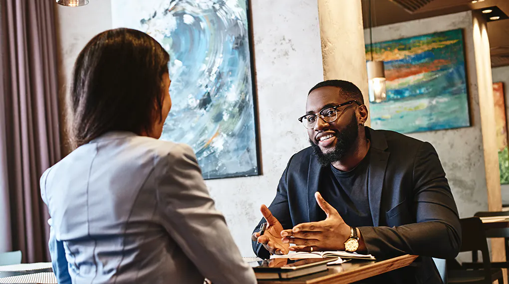 Two co-workers in a business meeting