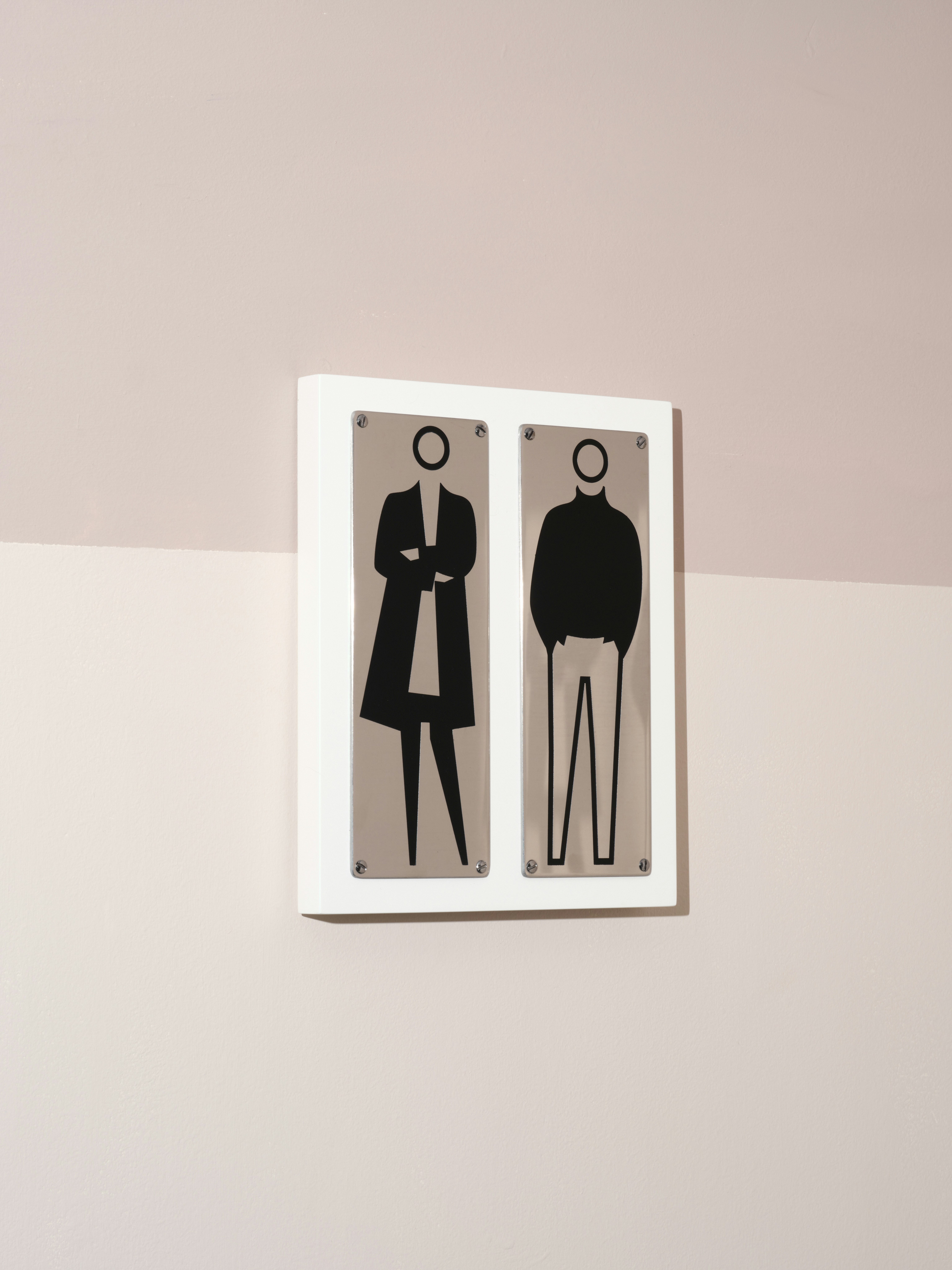 installation photograph of paint on etched stainless steel by Julian Opie depicting a woman and a man