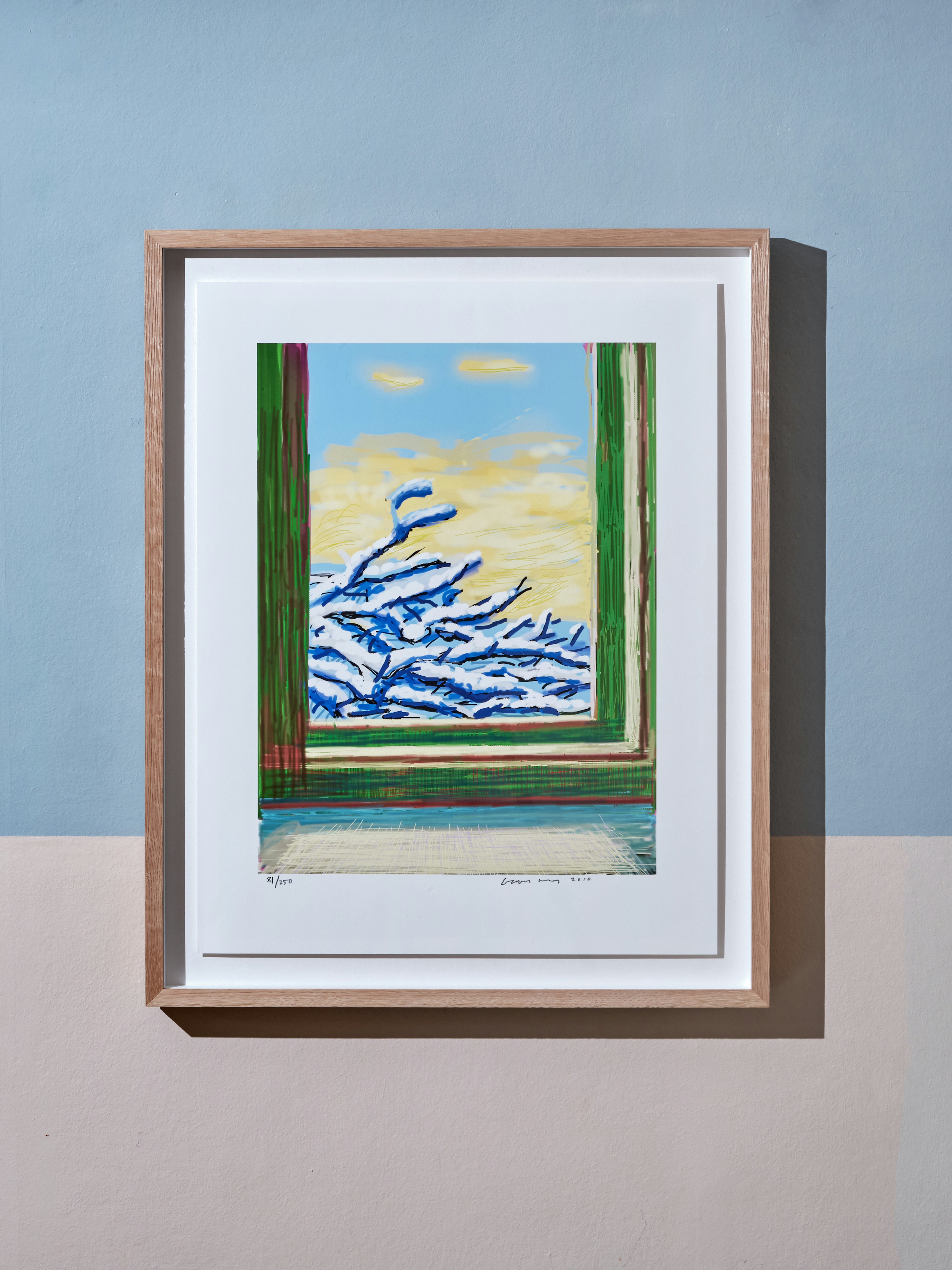 Installation photo of iPad drawing in colours by David Hockney depicting winter scenery through window with tree branches covered in snow