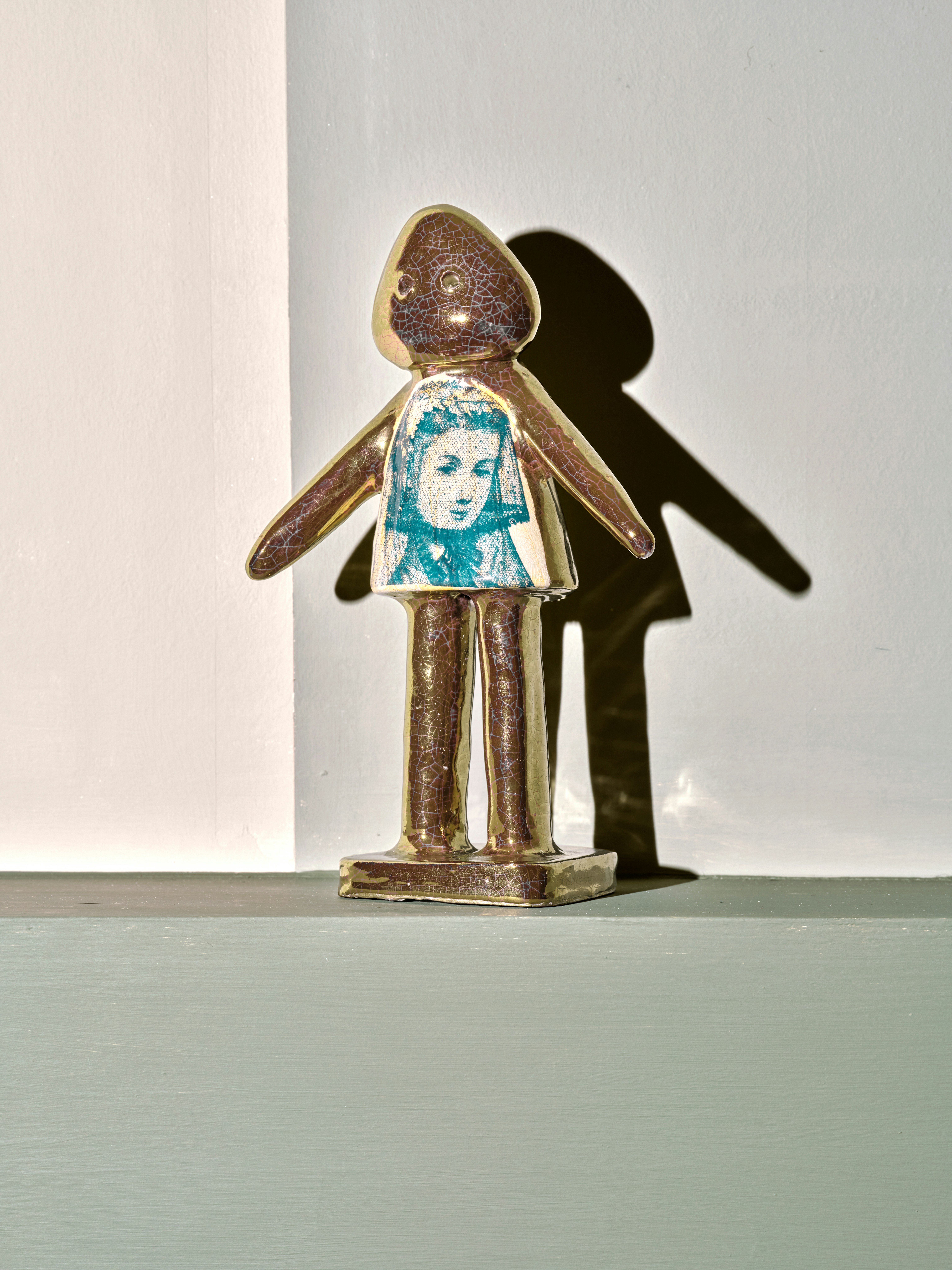 Glazed ceramic gold statuette by Grayson Perry