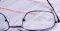 eyeglass on paper