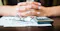 man folding fingers