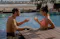 Couple relaxing in pool