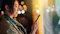 Female looking at her phone in front of a window