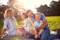 Family sitting on grass