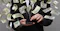 man on mobile with money flying around