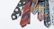 A selection of neckties featuring vibrant, artistic designs and patterns, showcasing unique and creative fashion accessories.