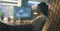 Person working at a desk using 3D modeling software to design a turbine engine on a computer monitor