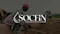 Cover image showing women working in a field, overlaid with the Socfin logo.
