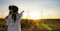 Female pointing towards Sun
