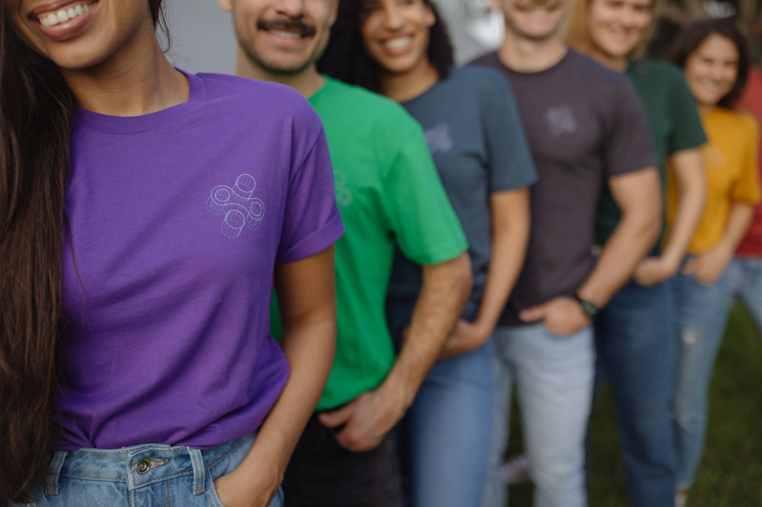 A group of 7 all wear matching custom t-shirts in different shades 