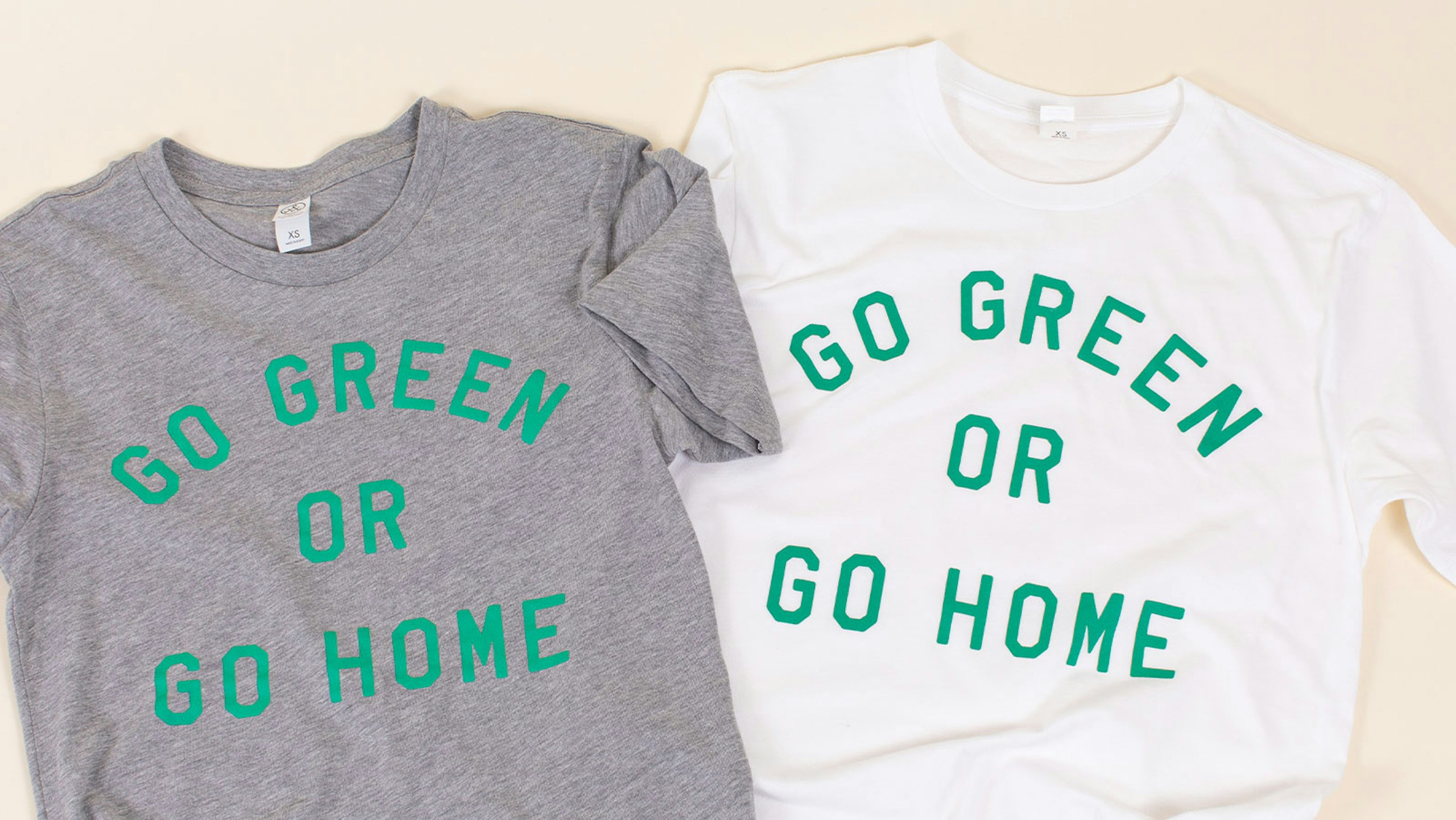 Two t-shirts layout with the text, "go green or go home" printed on them