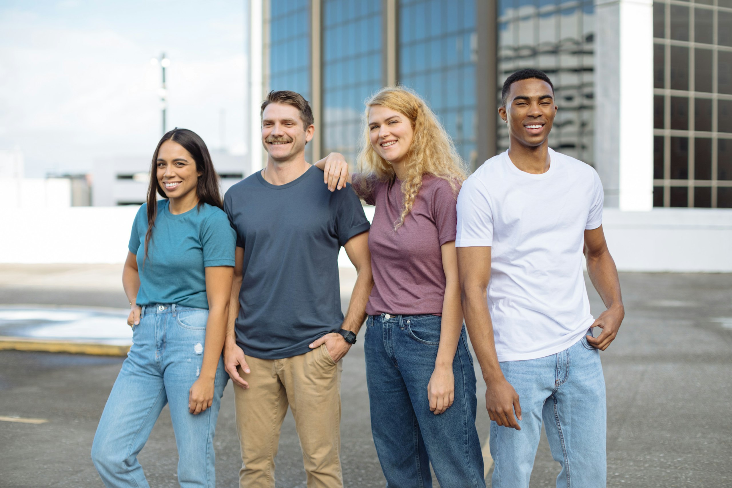 Four people posing for an image.