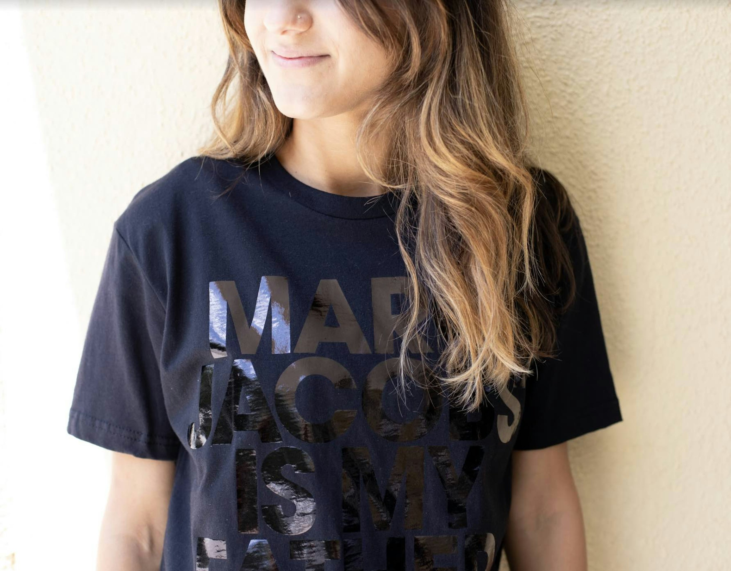 women wearing a black t-shirt with black foil print