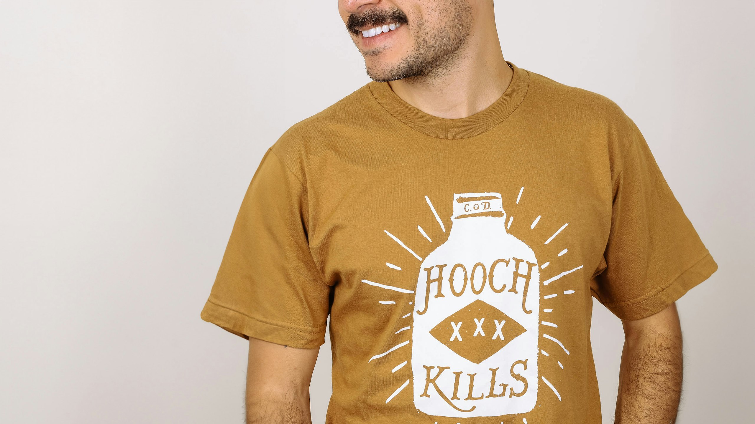 man wearing a mustard color shirt