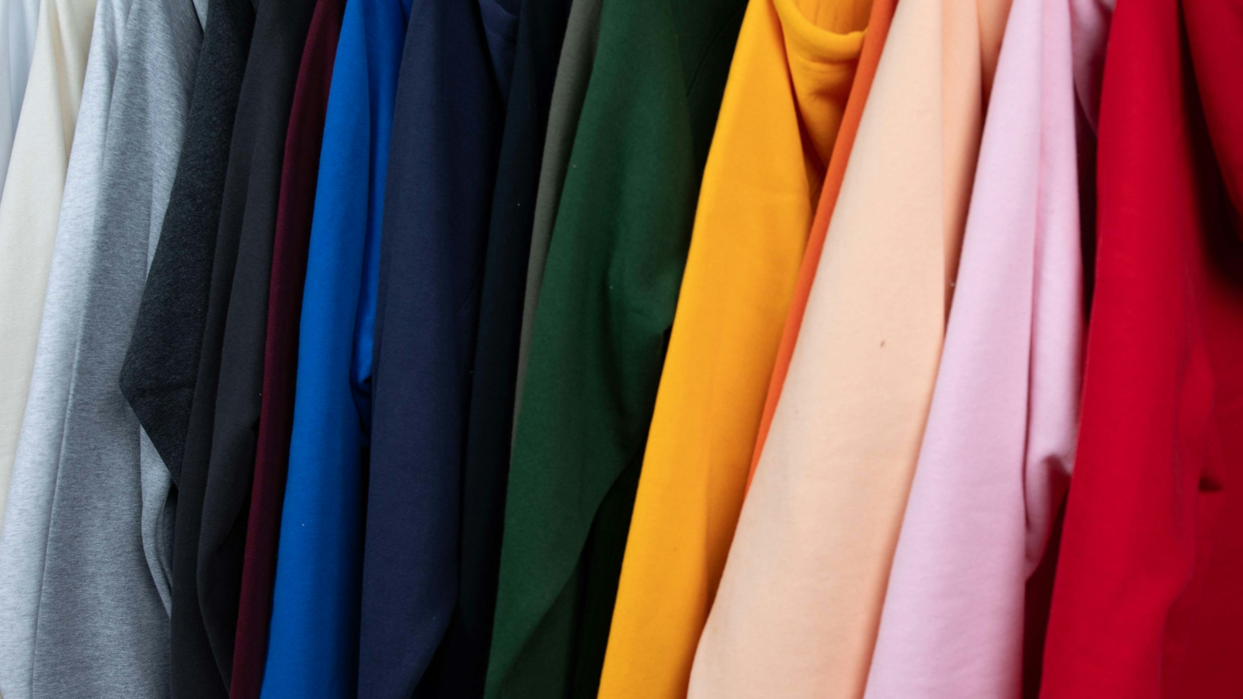 an assorted color of hoodies