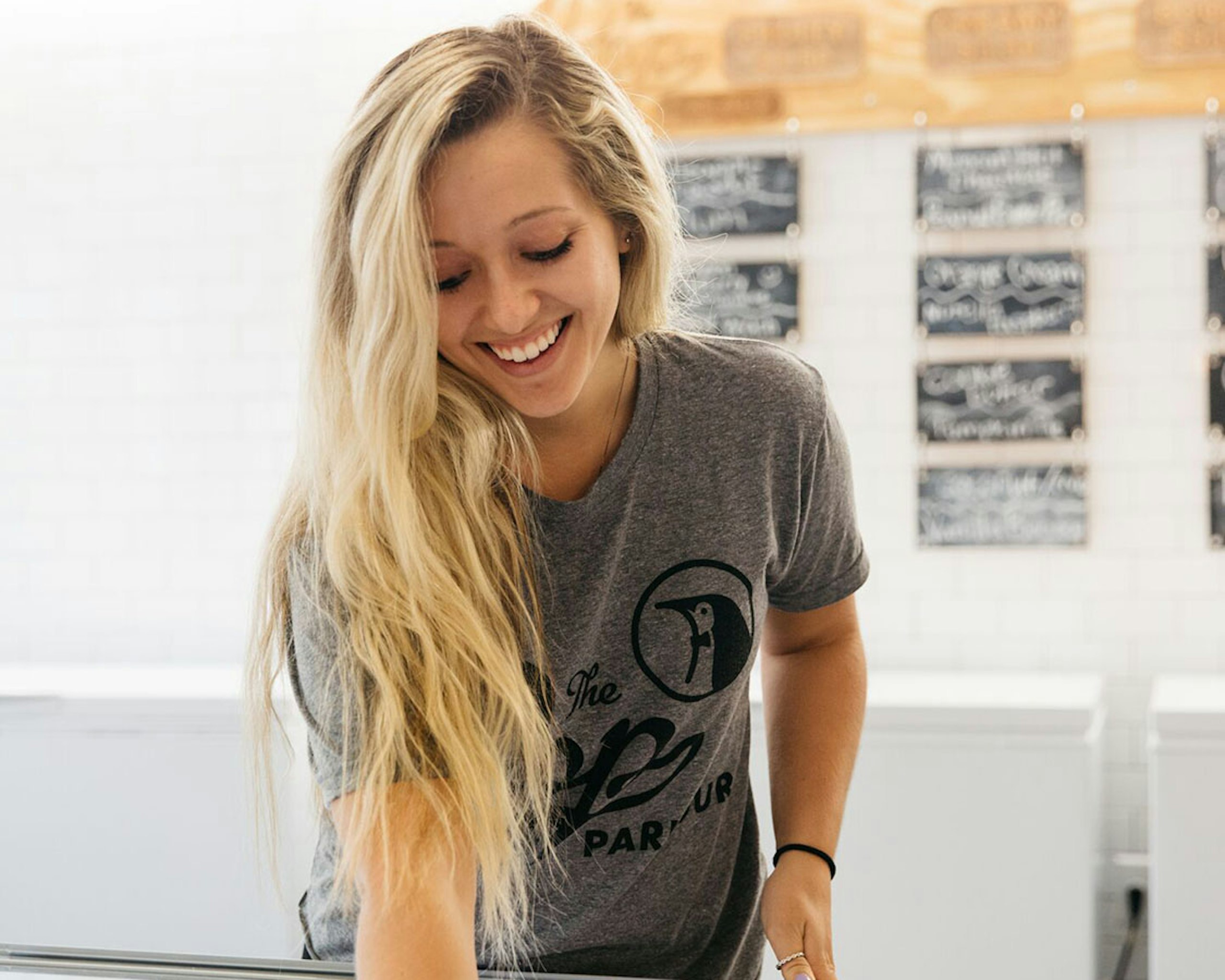 girl smiling and getting ice cream