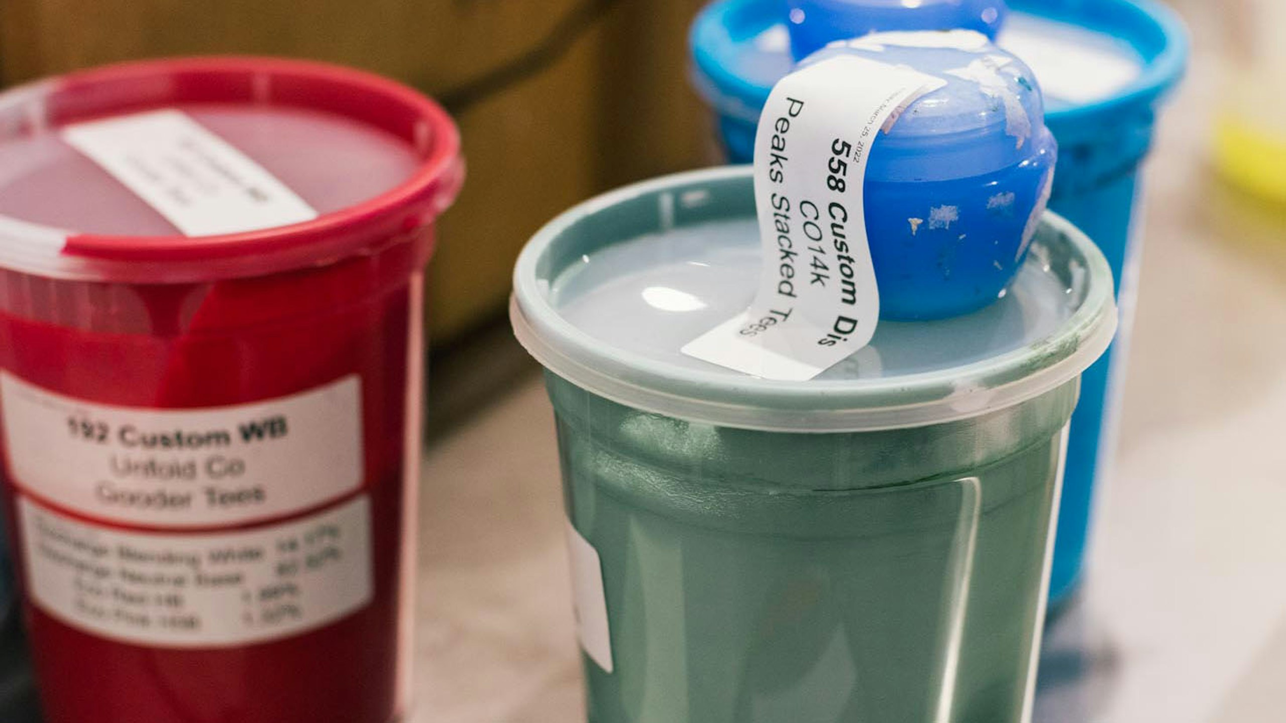 red, green, and blue ink in 2 quart containers