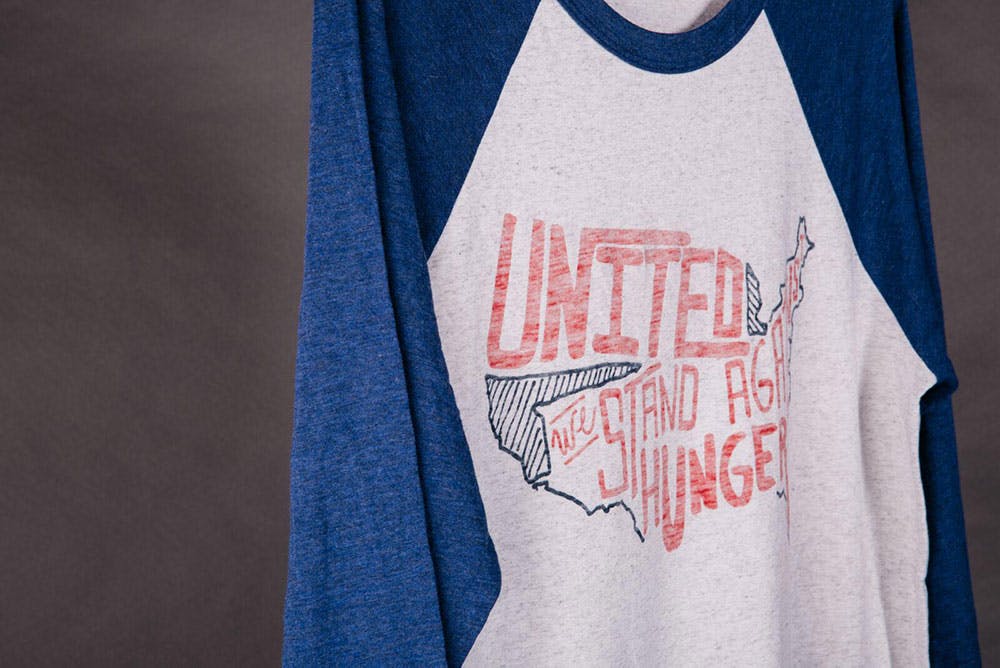 3 quarter length baseball t-shirt with a printing of the united states on it