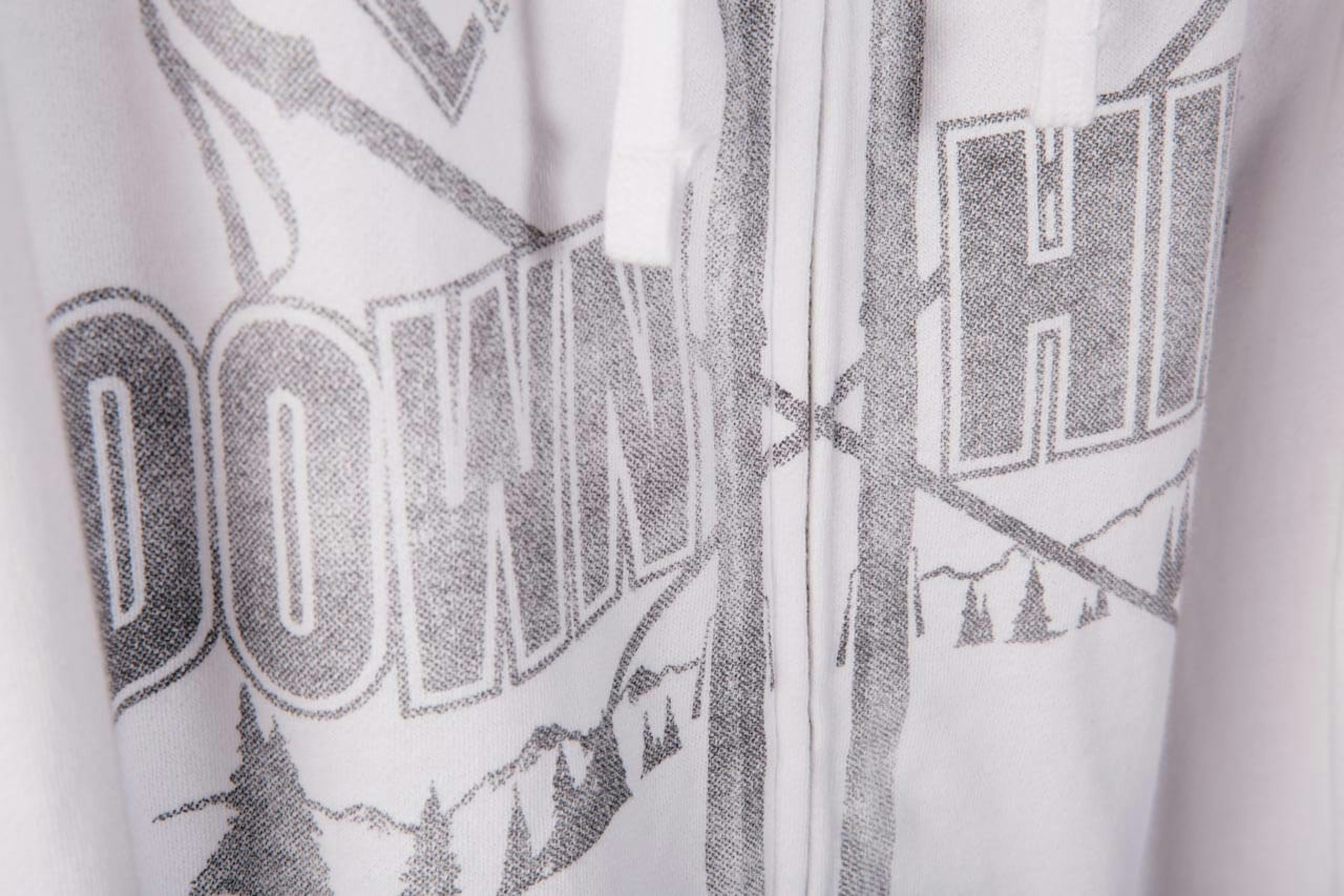 white sweatshirt with gray over the zipper printing 