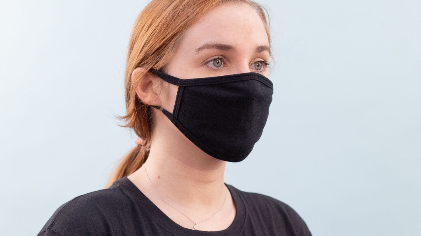 women wearing a black mask