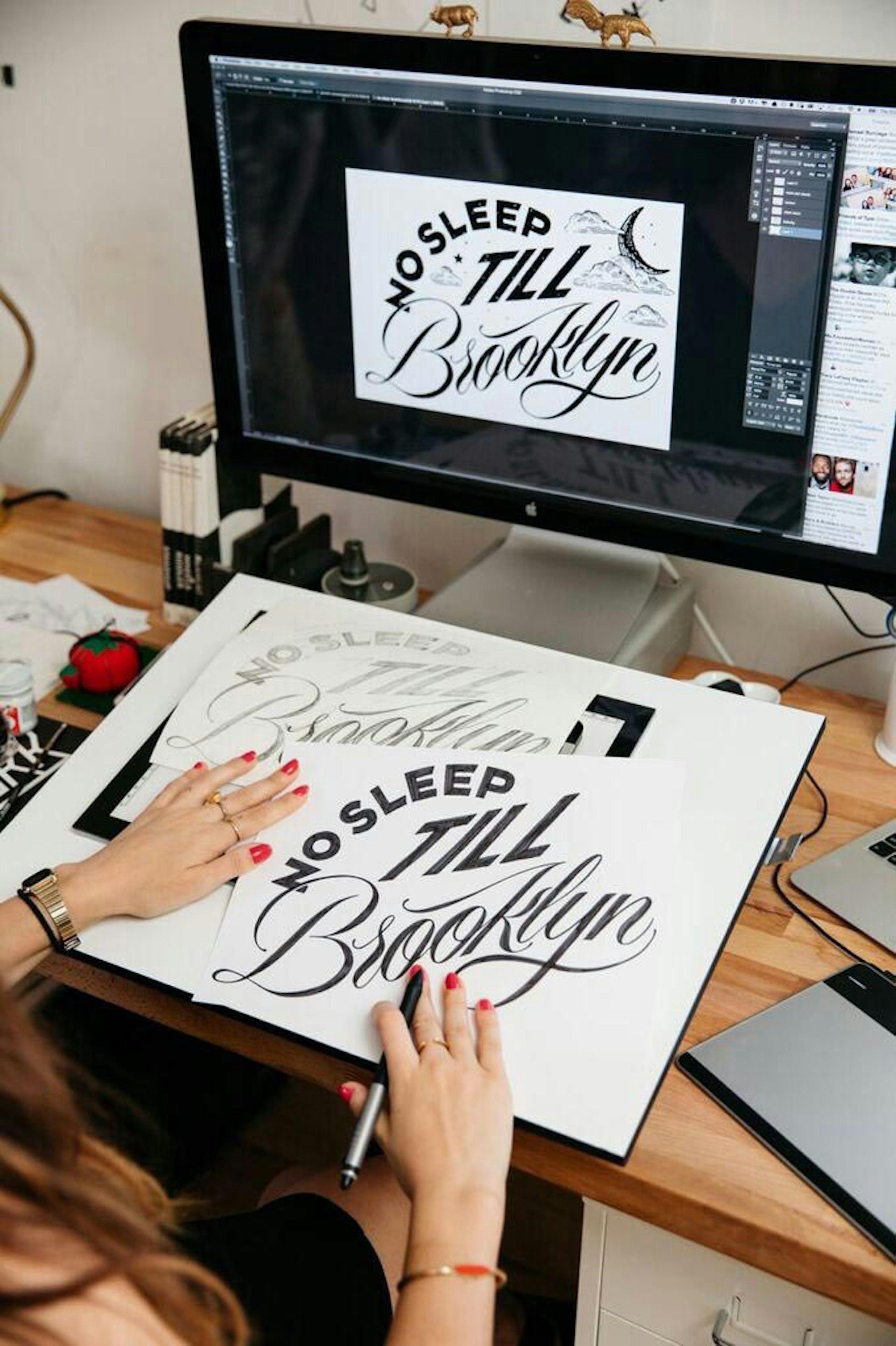 someone creating a design from sketch to computer illustration