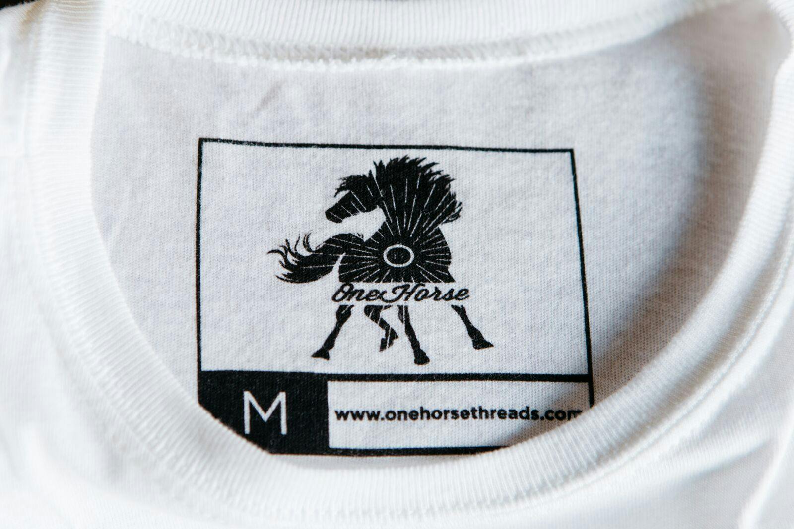 printed tag with a large outlined box with the logo inside printed tag with a large outlined box with the logo inside