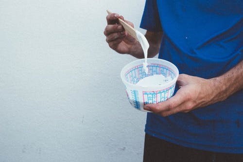 someone holding a container of ink someone holding a container of ink