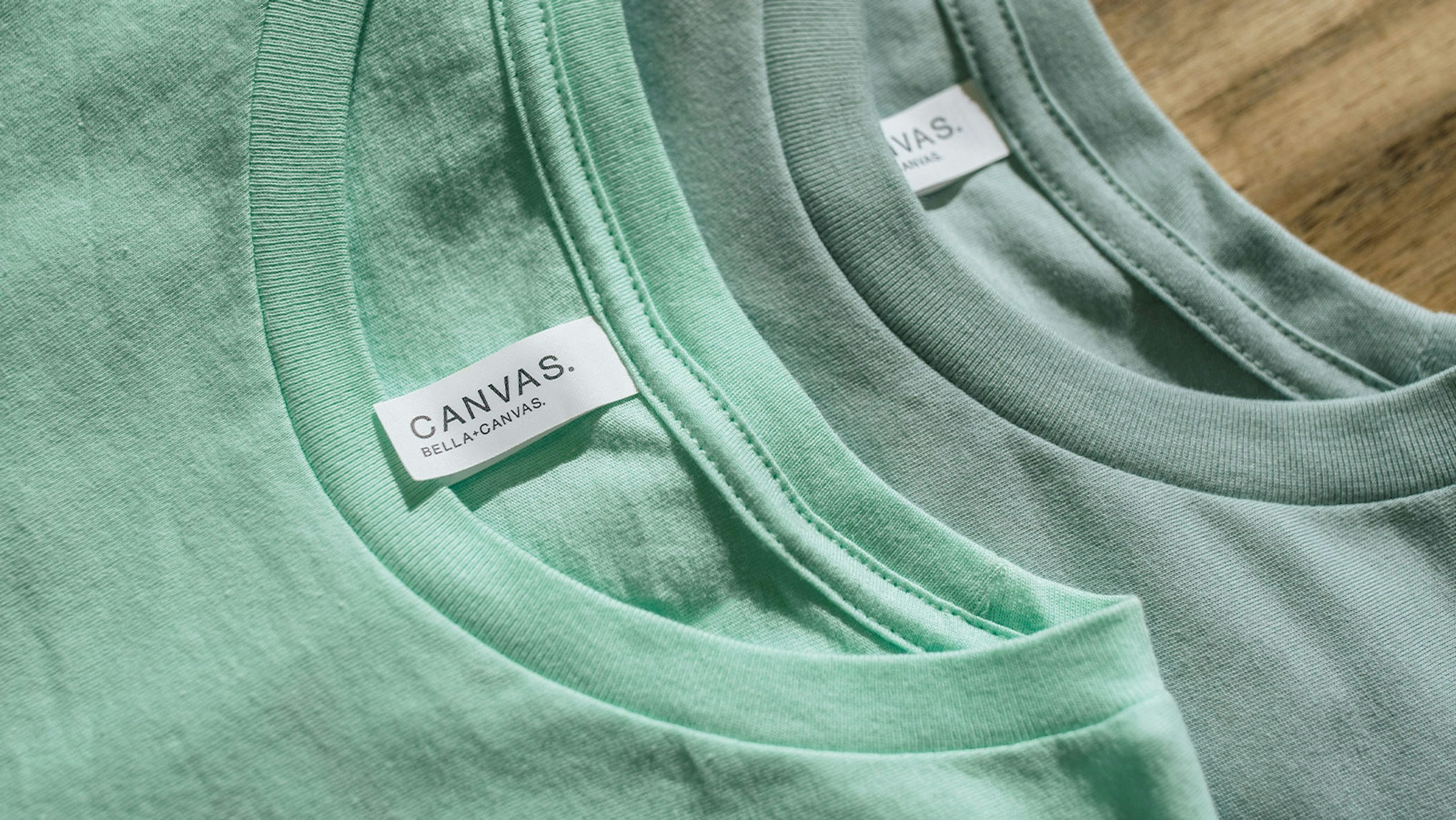 the collar of two green t-shirts