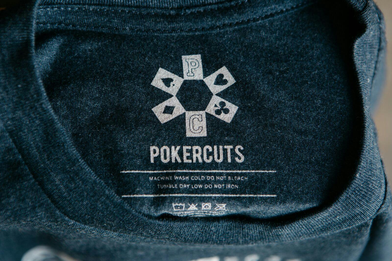 navy shirt with a close up of a printed tag navy shirt with a close up of a printed tag