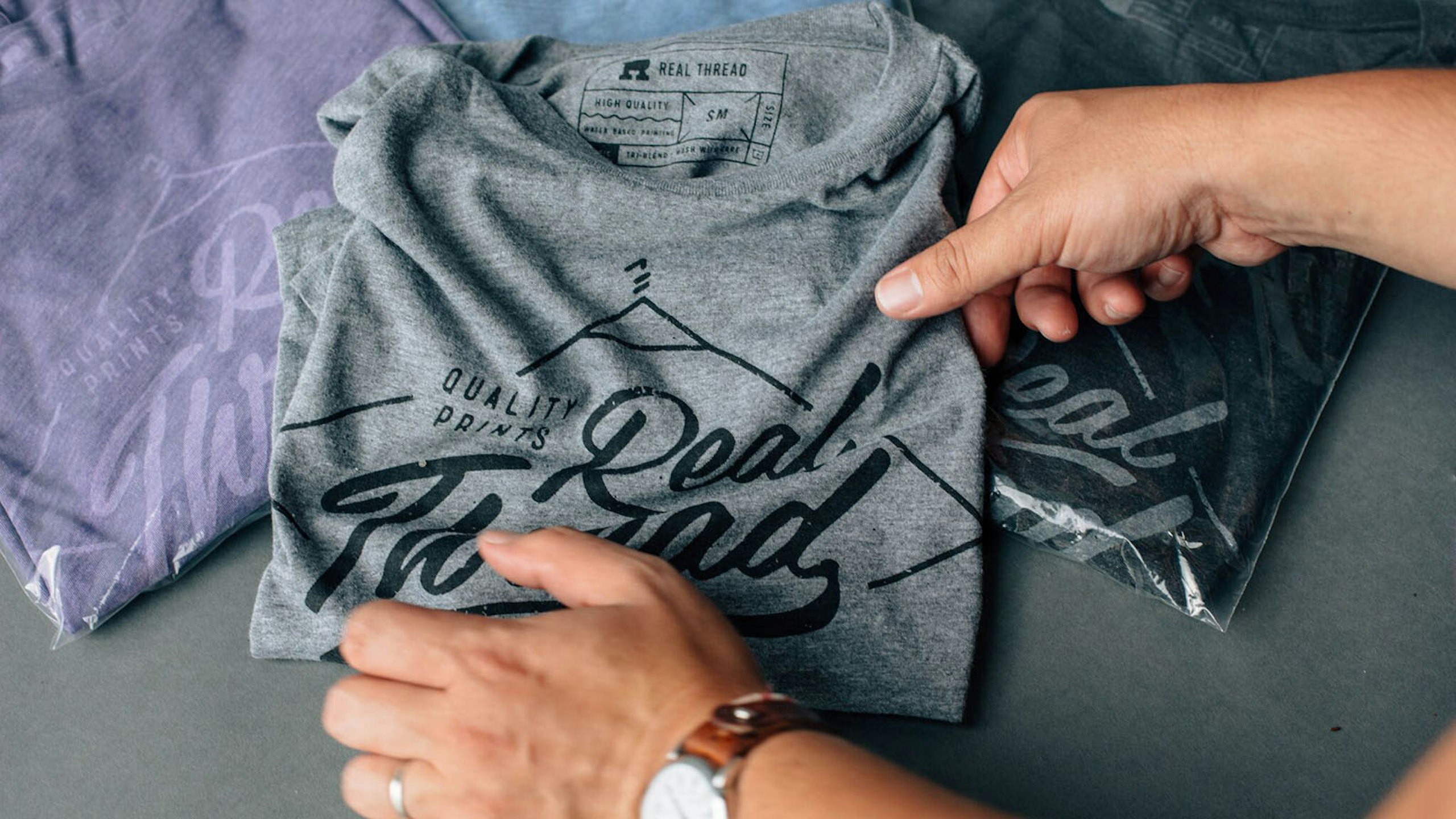 gray shirt being packaged