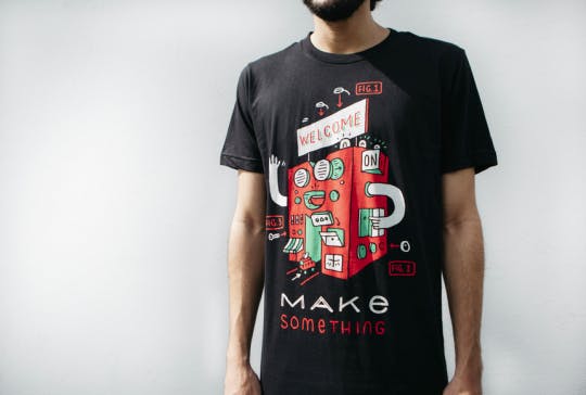 man wearing black shirt with front red graphic man wearing black shirt with front red graphic