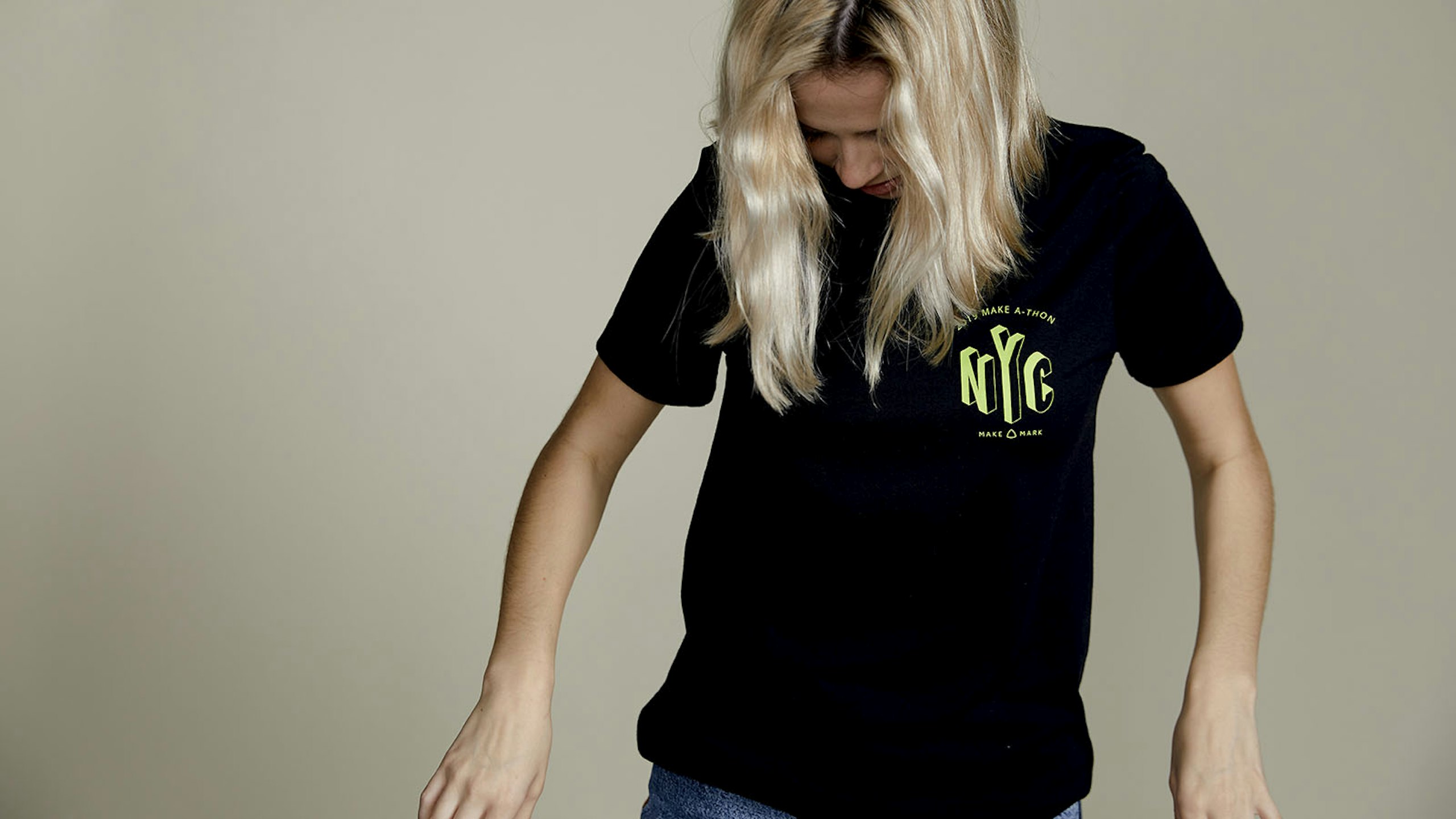 a person wearing a black shirt with a bright yellow print